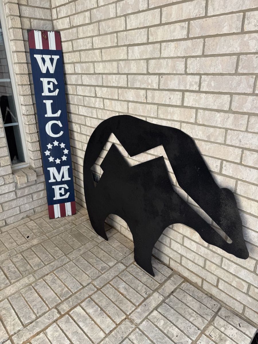 Welcome sign and Heavy Metal Bear
