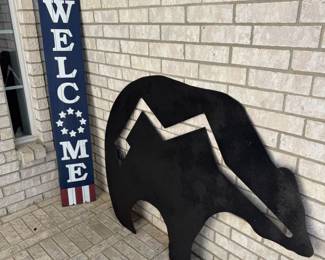 Welcome sign and Heavy Metal Bear