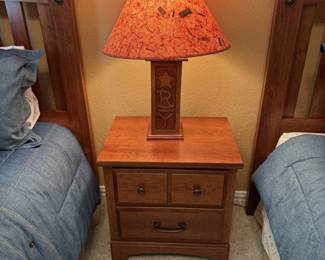 Closer view of nightstand and lamp