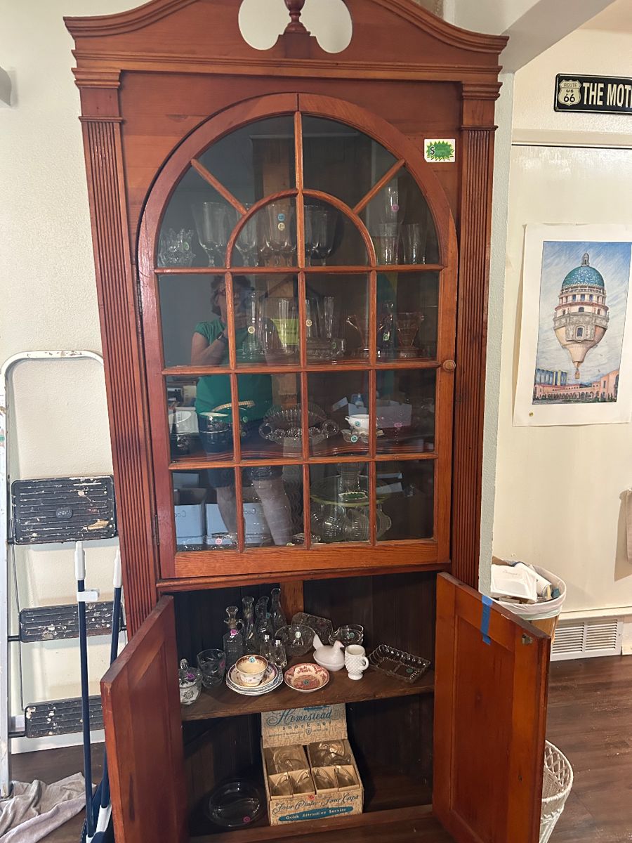 Antique corner cabinet, filled with collectibles. Included are luncheon sets, depression glass stemware, pressed glass serving pieces.