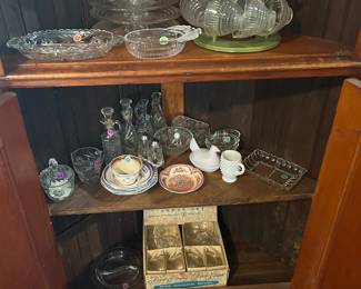 Contents of upper and lower sections of antique corner cabinet