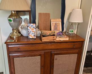 Bedroom chest with shelves and drawer, crystal lamps, mirror, costume jewelry 