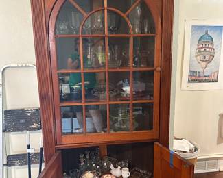 Antique corner cabinet, filled with collectibles. Included are luncheon sets, depression glass stemware, pressed glass serving pieces. 