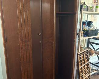 Antique art deco Armoire. Has shelf and rod on right side and is open storage on the left side