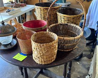 Assorted baskets on top of gate leg project table