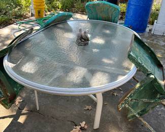 Oval table and four metal chairs, rain barrels and footed tub. Chairs are listed as a set separate from the table 