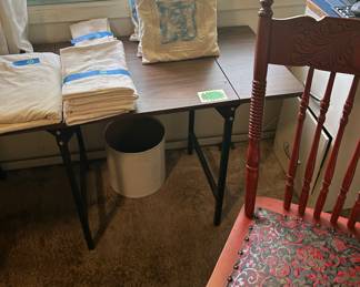 Red “antiqued” chair (only 1), miscellaneous throw pillows and linens