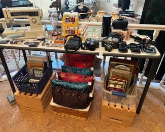 Various cameras…one movie camera, Kenmore Sewing machine, Burt’s Bees items…great stocking stuffers 