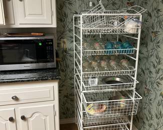Awesome 5 ft high stand with pullout wire baskets , canning jars