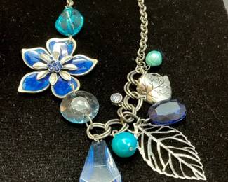 Necklace with blue enamel flower charm 