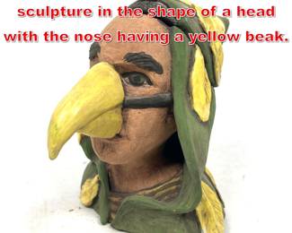 Lot 82 Marlen Ceramic covered box sculpture in the shape of a head with the nose having a yellow beak.