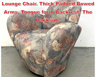 Lot 557 Unusual Design Swivel Arm Lounge Chair. Thick Padded Bowed Arms. Tongue form Backrest. The Backside 