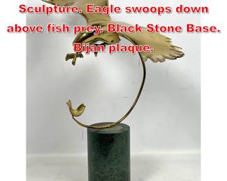Lot 113 BIJAN Brass Modernist Sculpture. Eagle swoops down above fish prey. Black Stone Base. Bijan plaque. 