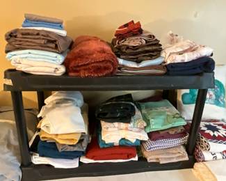Bedroom- tablecloths - mostly large rectangle style along with pillowcases, various other blankets etc 