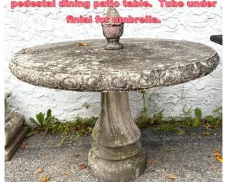 Lot 1696 Weathered cast stone garden pedestal dining patio table. Tube under finial for umbrella. 