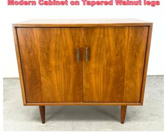 Lot 1366 Walnut two door Mid Century Modern Cabinet on Tapered Walnut legs