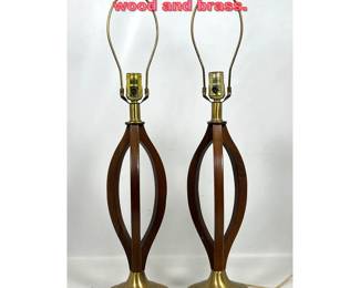 Lot 1399 Pair Modeline Lamps. Curving wood and brass.