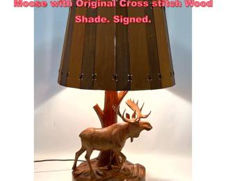 Lot 1568 DUBE Carved wood Table Lamp. Moose with Original Cross stitch Wood Shade. Signed. 