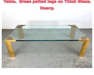 Lot 1478 Large Lorin Marsh Style Coffe Table. Brass palted legs on Thick Glass. Heavy. 