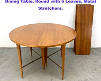 Lot 611 Paul McCobb Calvin Extension Dining Table. Round with 6 Leaves. Metal Stretchers.