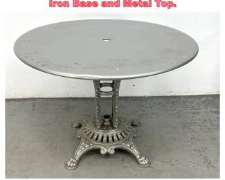 Lot 1677 Bistro Patio Tablew ith Ornate Iron Base and Metal Top. 