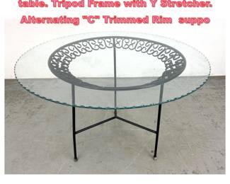 Lot 1657 Arthur Umanoff round dining table. Tripod Frame with Y Stretcher. Alternating C Trimmed Rim suppo