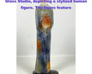 Lot 748 Art glass sculpture by Cassandre Glass Studio, depicting a stylized human figure. The figure feature