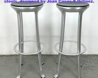 Lot 1079 Pair of Indecasa aluminum bar stools, designed by Joan Casas Y Ortinez.