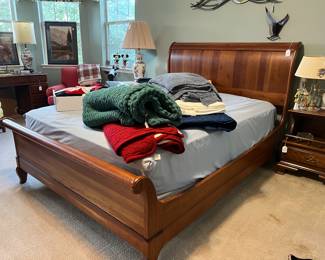Solid cherry sleigh bed, queen size.  just beautiful!  Does not include mattress and boxspring. $480.