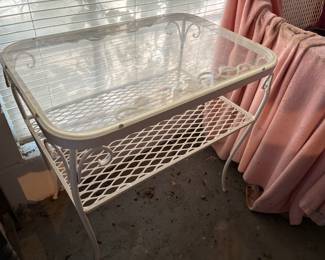 Love the outdoor furniture. Nice iron. There is this table. A chair and a bench.