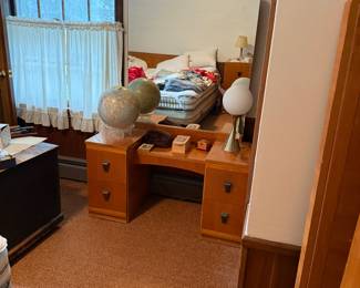 M-C era vanity that matches other bedroom suite items.