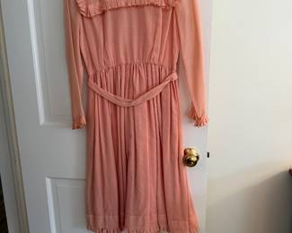 Sorry, misdescribed. It is not a Peretz  design; only part of label there.  The Peretz design is the other white dress. 