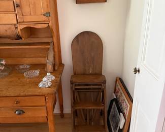 A spoon holder with group of silver plate spoons. 
A stool-chair-ironing board- step stool - now that’s repurposing. 
