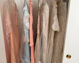 Group of vintage gowns and wedding dresses. 