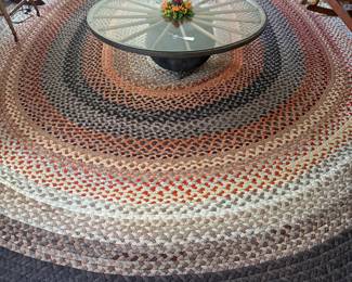 Large braided rug. 
Wagon wheel gas’s top low table with cast iron bucket as base. Great repurposing again. 