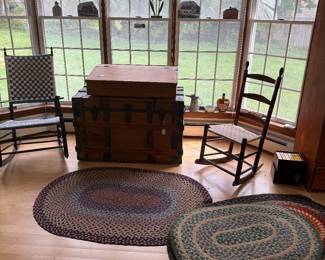 Shaker armed rocket that needs an easy repair. 
Large flat top trunk. School masters desk. 
Several braided rugs throughout home- some early. 
Shaker rocker.