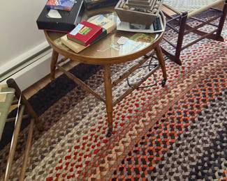 A early child’s walker converted to glass top end table. 
Throughout home are several vintage games. 