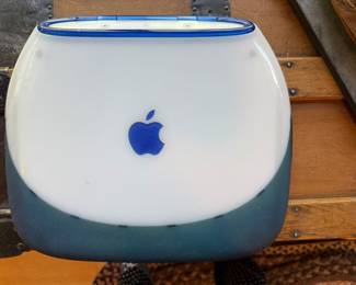 Original Apple “clam shell” laptop computer. 
