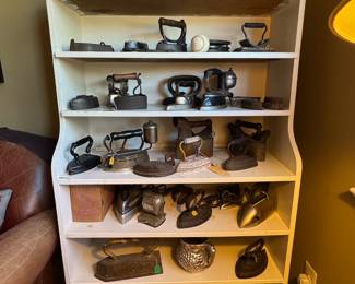 Large collection of antique irons and lanterns