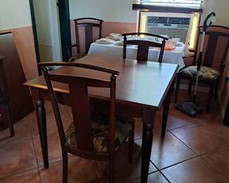 Ethan Allen table with 4 chairs and one insert (see leaning against the wall)
