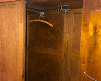 Interior of armoire - has a clothes bar on each side