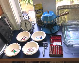Vintage kitchen scale, Kellogg’s character cereal bowls, blue fondue pot, Pyrex baking dishes, Selandia Denmark stainless tray, vintage aluminum trays 