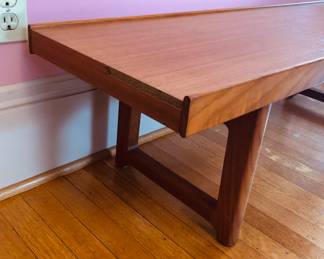 Side view of bench - has some missing veneer on edge