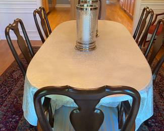 Ethan Allen Cherry finish dining room table and chairs shown with tablecloth and Ethan Allen pads. Two Leaves are included.