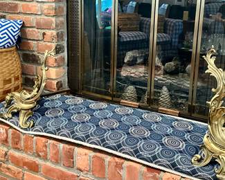 A Pair of 18" Rococo-Style Solid Brass Andirons Shown with a Custom-Made Hearth Pillow, 16.5"D x 55"W.
