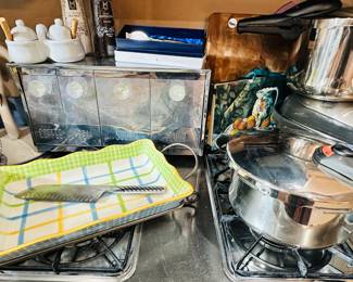 Mid Century Modern Krestline Speco Stainless Canister, Fabulous Brand New Cook's Essentials (Spain) 4 L Pressure Cooker, Shown with an American Ware Baking Dish with Stand, a 7" Santoku (Japan) Stainless Steel Knife,