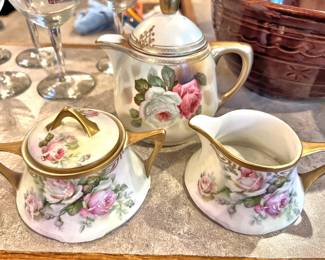 Antique porcelain tea pot, sugar and creamer