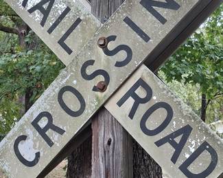 Retired Railroad Crossing Sign on Post.
