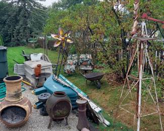 ONE IRON  AND ONE HEAVY CLAY FIRE PIT POT WITH BOTH  TOPS AND IRON STANDS..WIND MILL