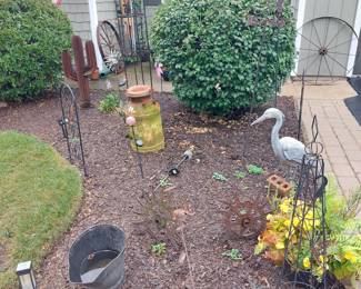 LOTS OF IRON GARDEN DECOR AND 2 LG. ANTIQUE IRON WAGON WHEELS